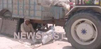 In this mandi of district, farmers escape from sun by sitting under the trolleys