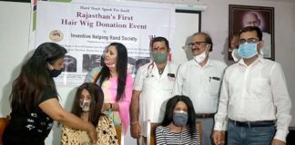 Distribution of hair wigs to poor children suffering from cancer